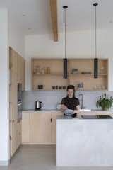 In keeping with a pared back aesthetic, Brown &amp; Brown designed a custom plywood kitchen, carrying the timber through as internal doors and the dining room’s storage bench.