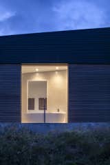 The clients wanted a house that could offer fantastic views of the landscape from every room—including the bathroom—whilst protecting them from the worst of the Cairngorms weather.