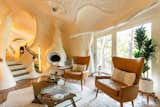 The Bloomhouse was designed and built by architects Charles Harker and Dalton Bloom when they were students back in 1984—and since then it’s been compared to everything from a seashell to a unicorn. It was restored in 2017 and has become arguably one of the world’s weirdest rental homes. Located in a wooded valley on the outskirts of Austin, Texas, the whimsical home is all sinuous curves and sweeping organic lines. As the Airbnb listing puts it: "Without one straight line or corner in the entire structure, your thoughts are free of the constraints that our angular world creates."