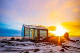 Surrounded by 500 hectares of natural lava fields in Hella, Iceland, this glass cottage—with an open-air hot tub on the deck—immerses guests in Iceland’s spectacular landscape. Enjoy endless sunsets and sunrises from the comfy bed in the summer, and the opportunity to drift off to sleep beneath the Northern Lights and one of the world’s most impressive starscapes in the winter. Even the glass-wrapped bathroom boasts views of the country’s largest volcanoes, Hekla, Eyjafjallajökull, Bláfjöll, and Tindfjöll.