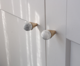 New handles added to a standard IKEA wardrobe in the master bedroom elevate the appearance and perceived value of the wardrobe.