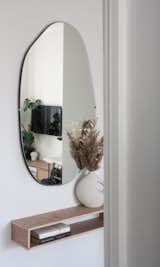The mirror above the bespoke ply console that hangs in the entry is from H&amp;M Home. "I knew exactly what I wanted and was struggling to find it,