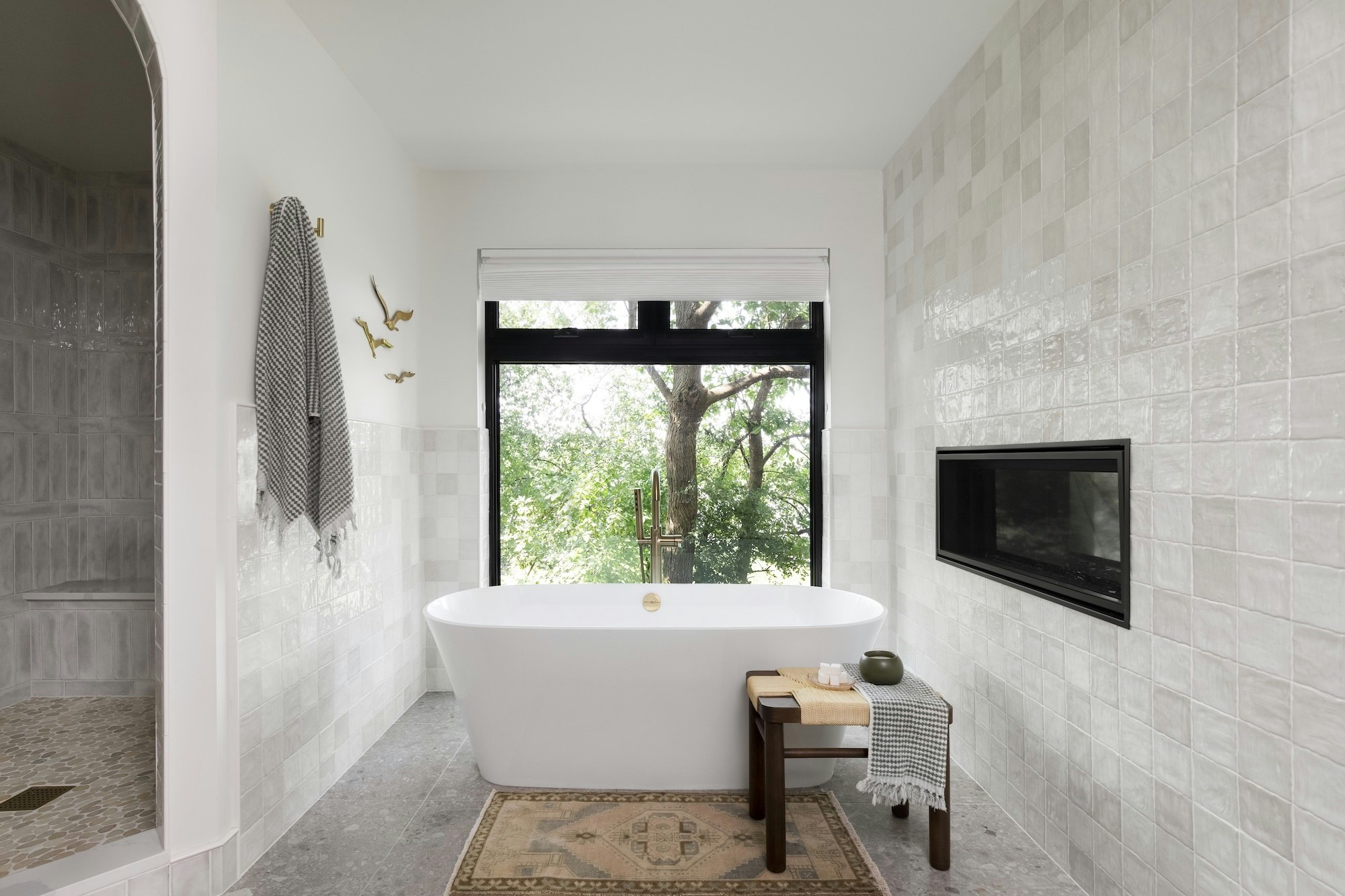 Symmetrical modern bathroom with LED lighting and natural marble