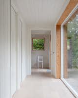 The light interior stands in stark contrast to the black exterior. "The timber cladding inside is painted quite roughly,