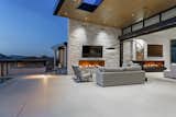 Long, linear Isokern fireplaces built from custom masonry are a prominent design feature in the great room and the exterior patio.