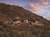 Modern Sunset House is located on 14 acres of hillside. During construction, a driveway stretching 1000 feet—more than three football fields—had to be installed to reach the remote location above Scottsdale.