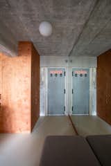 The mirrored wall and pivoting door also reflect abundant light into the previously dark entranceway.