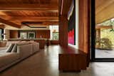 At the heart of the open-plan living space is a great room that opens outward beneath an expanse of laminated Douglas Fir beams and western red cedar soffiting.  Photo 5 of 17 in This Vacation Home in Rural Ontario Sets a New Standard for Prefab Architecture