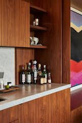 The mixology station has a clever door system meaning it can be completely hidden away or opened up as the family desires.  Photo 10 of 17 in This Vacation Home in Rural Ontario Sets a New Standard for Prefab Architecture