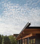 The elegant prefab construction features glulam beams that support a steel scupper off of which water plumes during a rainfall—yet another nod to  the landscape and natural elements.  Photo 17 of 17 in This Vacation Home in Rural Ontario Sets a New Standard for Prefab Architecture