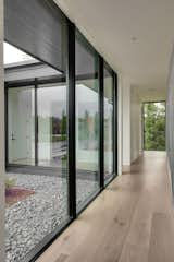 The floor-to-ceiling windows throughout the home are proportionally scaled with reference to the Kolbe VistaLuxe AL multi-slide door on the lower level, creating a pleasing sense of continuity and rhythm.