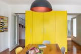 The kitchen opens up to the entrance hall on one side of the cabinetry and through to the playroom on the other side.