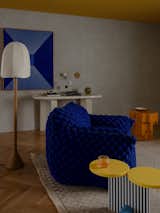 <span style="font-family: Theinhardt, -apple-system, BlinkMacSystemFont, &quot;Segoe UI&quot;, Roboto, Oxygen-Sans, Ubuntu, Cantarell, &quot;Helvetica Neue&quot;, sans-serif;">The living area is defined by a playful collection of furniture, includign a Nuvola 05 armchair by Gervasoni, an orange Altar Side Table by Tacchini, and an iconic Michele De Lucchi Memphis Milano Collection coffee table with a yellow top and striped base. The lamp is by French architect and designer P</span><span style="font-family: Theinhardt, -apple-system, BlinkMacSystemFont, &quot;Segoe UI&quot;, Roboto, Oxygen-Sans, Ubuntu, Cantarell, &quot;Helvetica Neue&quot;, sans-serif;">ierre Yovanovitch.</span>