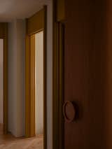 The round timber handle found on the front door is designed by Studio Prineas. "We designed them quite a few years ago and they now appear regularly in our projects,