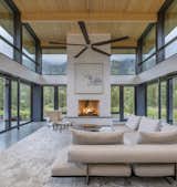 Looking out from the kitchen island to the great room offers a 270-degree view of the surrounding landscape. "You stand in the kitchen and can track the ridge line all the way around," says Bob. "You see how the light moves within the space in this magical, harmonious way."