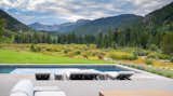 The pool and patio overlook untouched wilderness—through which moose and elk often wander—offering a spectacular balance between luxury amenities and a connection with nature.