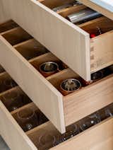 The drawers in the bespoke kitchen are crafted from solid maple with dovetail construction. The custom dividers keep everything organized and make preparing meals a pleasure.