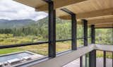 The beautifully crafted timber beams and ceiling appear to fly through the clerestory windows. emphasizing the connection between inside and out.