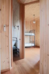 The home’s modest scale is offset by carefully considered proportions. At 3.5 x 2.8 metres, the secondary bedroom comfortably accommodates bunk beds for the two children and still allows room to move freely. The vertical layout of the bunk beds makes full use of the ceiling height. “It doesn’t feel tiny, even though it is,” says Lev.