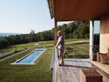 The primary suite also features its own covered outdoor space. "The colors are constantly changing and the meadow changes every year," says Michael. "There are things that happen in the meadow that did not happen the year before. And that, I find just fascinating."