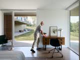 The ground floor bedroom is cooler and more shaded, with deep overhangs and a covered walkway that is cut out of the volume. "I have frequent house guests and they never want to leave as it’s just so restful," says Michael.