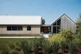 The Meadows reinterprets the barn vernacular of the Connecticut countryside with two gabled volumes connected by a glass-walled entry foyer, offering a contemporary twist on a familiar rural form.