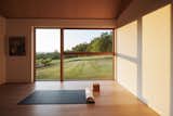 The fitness room faces north by design, allowing Michael to work out in soft, indirect light throughout the day without ever needing to close a shade.