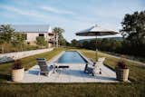 Set to one side of the property, the lap pool is tucked into the landscape and positioned to take in the views. "There’s nothing more luxurious than a lap pool when you’re a swimmer, but I didn’t want to be looking at a sad pool in winter," says Michael. "If I were living in California or someplace like that, it would be right in front of me all the time. But here, it's off to the side. So it's kind of its own world."