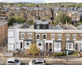 The loft extension is perched atop the red-brick terrace and clad in dark zinc—a material choice that is sensitive to the surrounding streetscape, while also immediately signifying the contemporary nature of the addition.