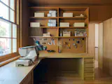 The storage in the sewing room has been designed to meet Leila's exact needs—including pattern shelves, bobbin holders, storage boxes, and pegboards. The pegboards are from IKEA and have been cleverly painted to match the rest of the joinery to make them appear bespoke.