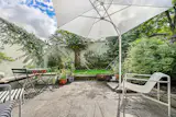 The small grassed area demanded maintenance without offering the pleasure of a real lawn.