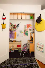 Emily and Drew converted a storage cupboard in their New York apartment into a playroom. "It was very clever," says Firmin. "They made it feel magical entirely through layered lighting."