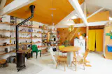 Shai Akram and Andrew Haythornthwaite live in a Victorian-era former flour shop in Stoke Newington. Instead of saving for a mortgage, they invested in making their rental entirely unique. All of the design moves, from the partitions and storage to the two mezzanines, are completely reversible (the partitions are made of full sheets of plywood held in place without nails).
