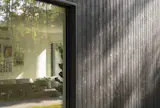 A close-up of the Nakamoto Forestry siding reveals the rich, naturally derived texture of the charred Japanese cedar.&nbsp;Produced using traditional charring rather than chemical or engineered wood modification, yakisugi is estimated to last 80 to 150 years.