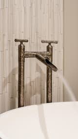 The design-forward WaterBridge Collection elevates raw plumbing parts to designer status. Choose from the Waterfall spout and the rustic look of split bamboo or the more utilitarian Elbow Spout, ideal for shallow basin sinks. Simple, yet strong, the WaterBridge Collection includes lavatory faucets, bar faucets, tub fillers, shower systems, and coordinating accessories. Be sure to look for the amazing WaterBridge exposed showers. Choose from Rustic Nickel, Rustic Copper, Satin Nickel or Oil-Rubbed bronze. Forged in America.