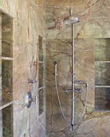 In the his & her bath of your dreams, you'll have a matching pair of feature-rich WaterBridge exposed #showers from Sonoma Forge, an extra WherEver rainhead with separate controls because why not? –granite walls and step-in from the backyard... just like this one! #luxury #decor