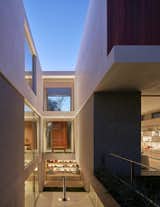 The three-story courtyard feeds light through each of the floors, while providing sight lines to the backyard, and above and below.