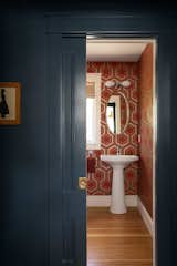 Bath Room, Pedestal Sink, Medium Hardwood Floor, and Wall Lighting Powder room.  Photo 4 of 11 in Hilltop by Caleb Johnson Studio