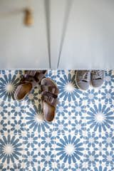 Concrete floor tiles in mudroom. 