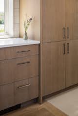 Kitchen, Wood Backsplashe, Wood Cabinet, and Engineered Quartz Counter  Photo 18 of 19 in Salt Spray by Caleb Johnson Studio
