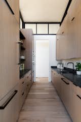 A butler's pantry nestled in between the dining and kitchen area.