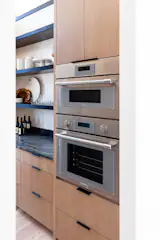 Simple cabinetry adorns this spacious butler's pantry.