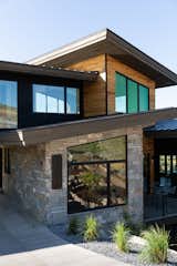 Various natural features combine on this home to aid in it blending with the mountain terrain.