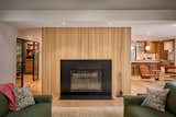 Updated fireplace with new white oak fluted paneling