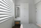 Bedroom with a arch mirror .