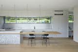 Kitchen, Pendant Lighting, Light Hardwood Floor, and Quartzite Counter  Photo 11 of 20 in House in Shiraiwa by Tsukasa Okada / 2id Architects