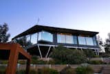 Walls of glass give the home a light and airy feel, allowing the landscape to be part of the interior