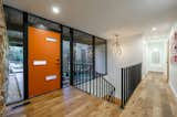Entryway = bringing the inside out with passthrough floor to ceiling windows