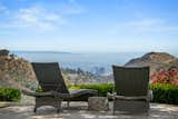 Outdoor, Back Yard, Landscape Lighting, Stone Patio, Porch, Deck, and Large Patio, Porch, Deck Mountain, City and Ocean Views  Photo 9 of 21 in True View Estate in Bel Air, California by George Salazar & Yana Beranek | Berkshire Hathaway California Properties