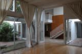 Living room and foyer looking into two courtyards (before conditions)